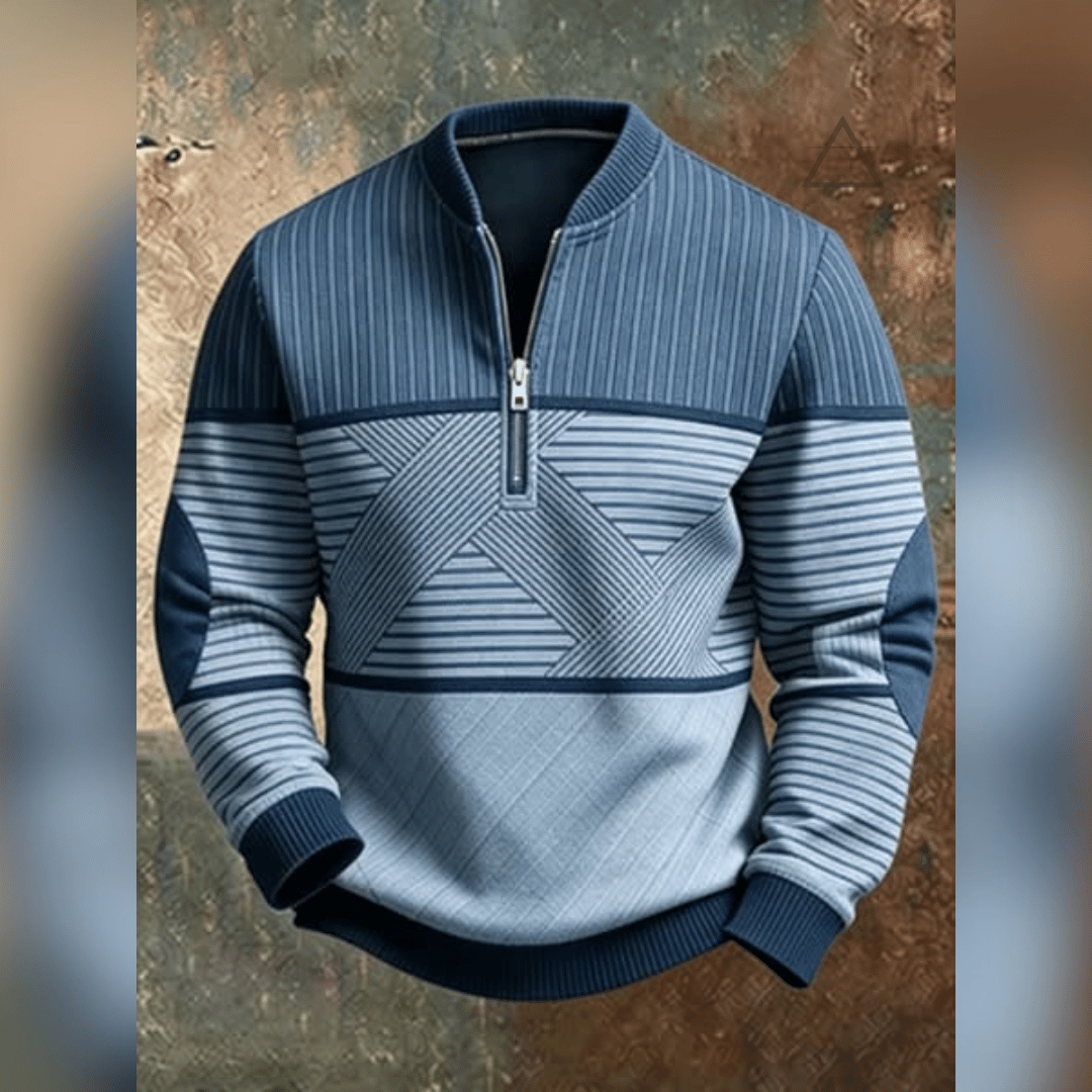 Haut Victor bleu ciel présenté à plat, manches croisées, avec motif géométrique imprimé et col à demi-zip